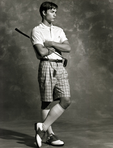 male model in bermuda shorts and polo shirt