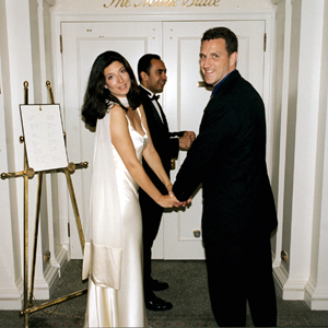 Erin and Blaze pause for photographer Steve Landis before they enter the wedding reception banquet room