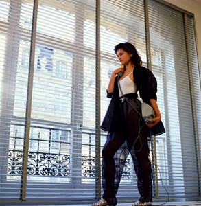 Karina Lombard by the windows with phone for Amica shot by Steve Landis