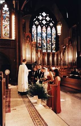 wedding party at alter during ceremony