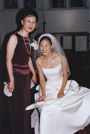 bride with her mother awaiting start of wedding, smile for photographer Steve Landis