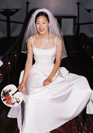 Sara in her bridal gowns prepares for her wedding vows